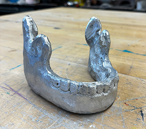 Image of the cast aluminum sculpture, Jaw by Samantha Stanton.